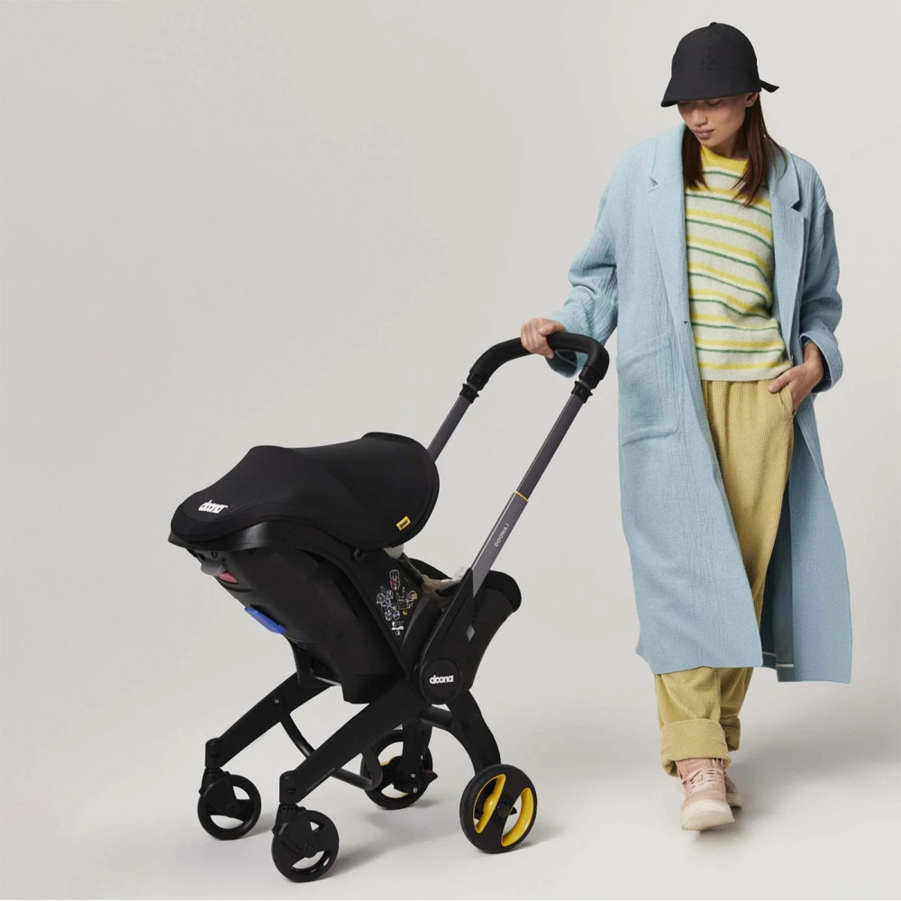 Doona i - автокресло-коляска для новорожденного i-Size (40 - 85 см / 1,8 - 13 кг), коляска для путешествий, использование в самолете • Nitro Black Doona i - автокресло-коляска для новорожденного i-Size (40 - 85 см / 1,8 - 13 кг), коляска для путешествий, использование в самолете • Nitro Black