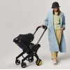 Doona i - автокресло-коляска для новорожденного i-Size (40 - 85 см / 1,8 - 13 кг), коляска для путешествий, использование в самолете • Nitro Black