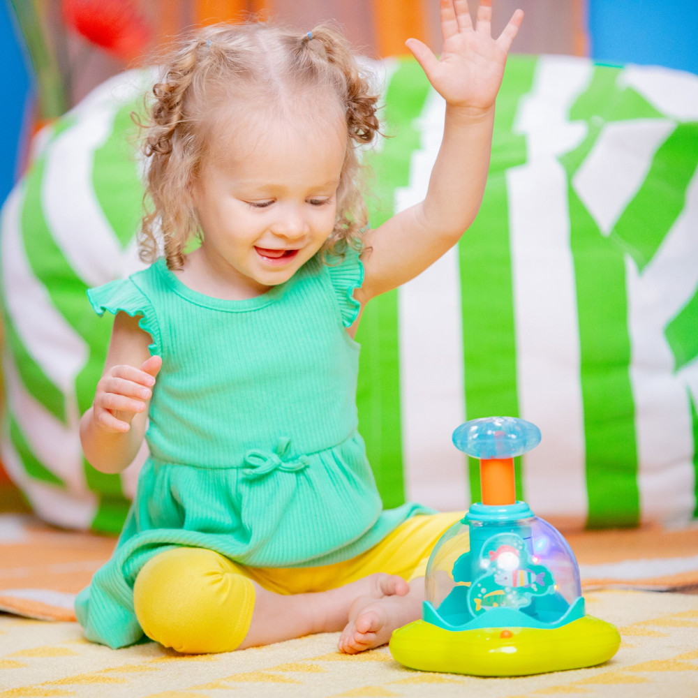 Дзиґа музична Bright Starts "Press & Glow Spinner"