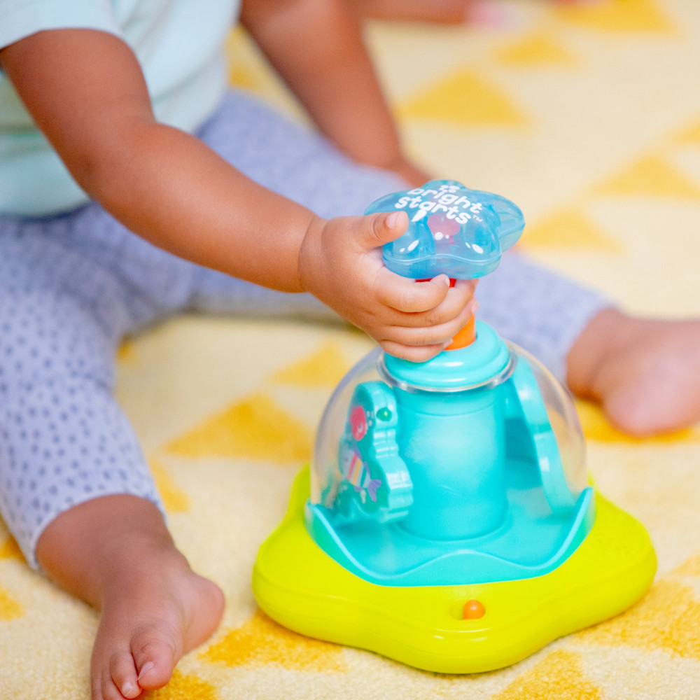 Дзиґа музична Bright Starts "Press & Glow Spinner"