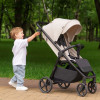 Carrello Bravo Lite CRL-5529 - прогулянкова коляска з підсвіткою, всесезонний візок, телескопічне регулювання ручки, великі колеса, захист від сповзання, зручно складається • Marble Beige
