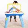 Baby Einstein Curiosity Table - ігровий центр із шестерінками, мелодіями та дошкою для малювання
