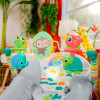 Bright Starts Playful Paradise - шезлонг з вібрацією та ігровою дугою з 4 іграшками