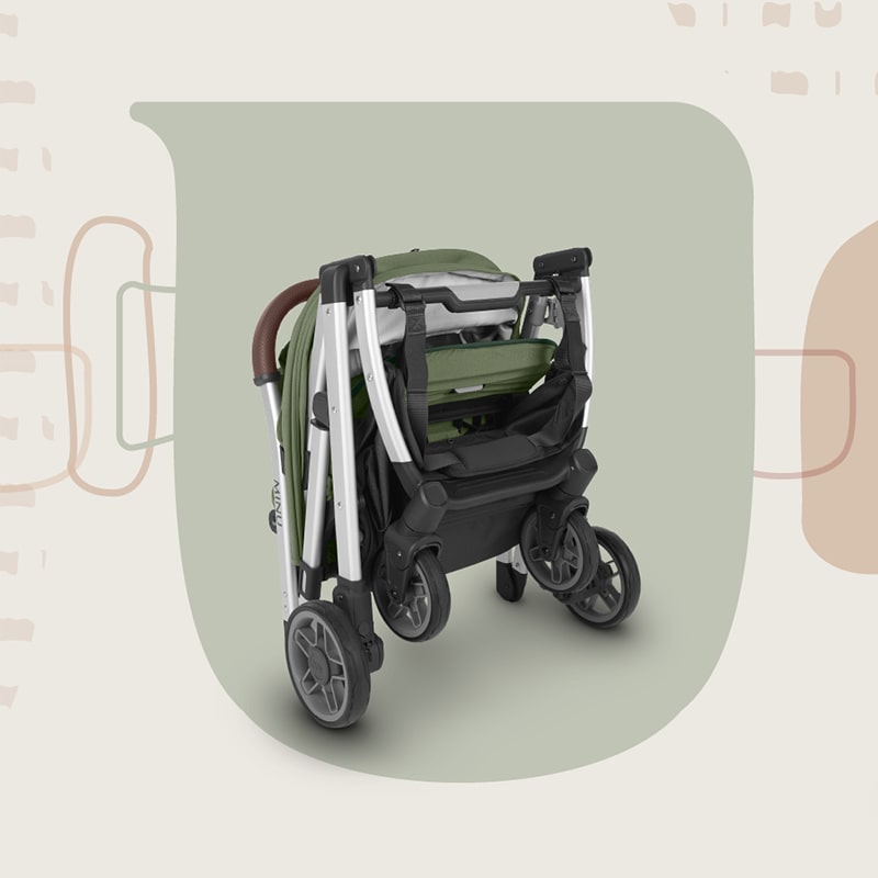 Складена прогулянкова коляска UPPAbaby Minu V2 стоїть вертикально